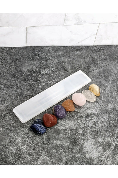 7 tumbled chakra crystals with a selenite charging tray