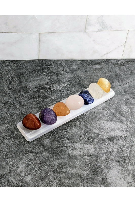 7 tumbled chakra crystals with a selenite charging tray