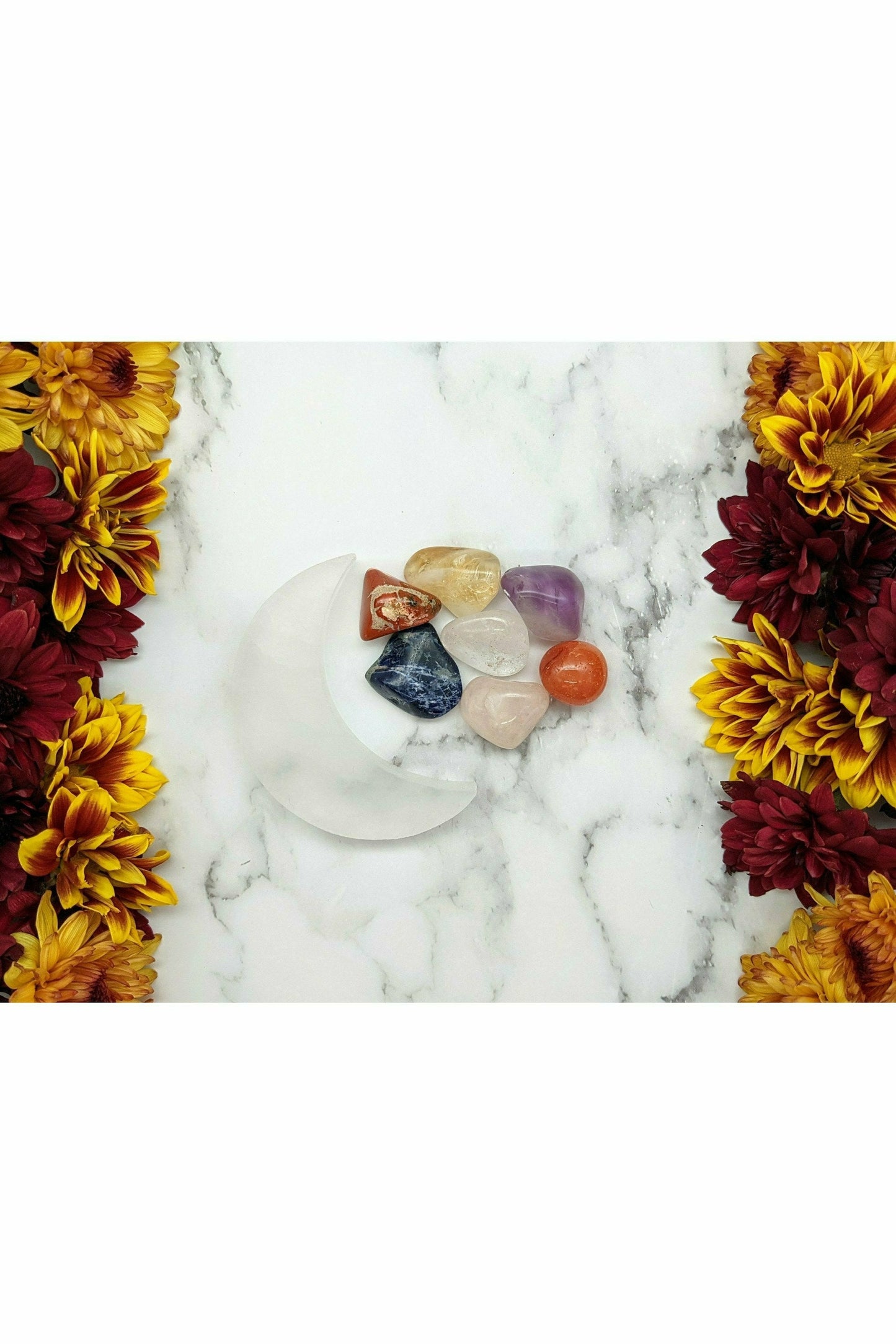 7 crystals set with selenite charging moon