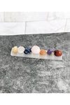 7 tumbled chakra crystals with a selenite charging tray