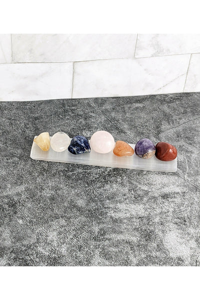 7 tumbled chakra crystals with a selenite charging tray