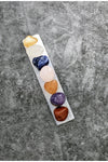 7 tumbled chakra crystals with a selenite charging tray