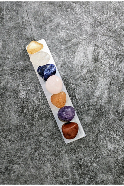 7 tumbled chakra crystals with a selenite charging tray